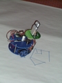 This is Brian's Wimo Bot.  It's not too happy being on paper instead of a white board, but you can see it drawing a house here.  Wimo Bot is a robot running off of a Windows Mobile device.