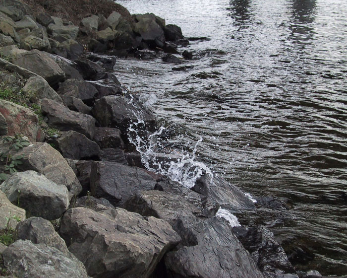 Some water splashing against rocks.